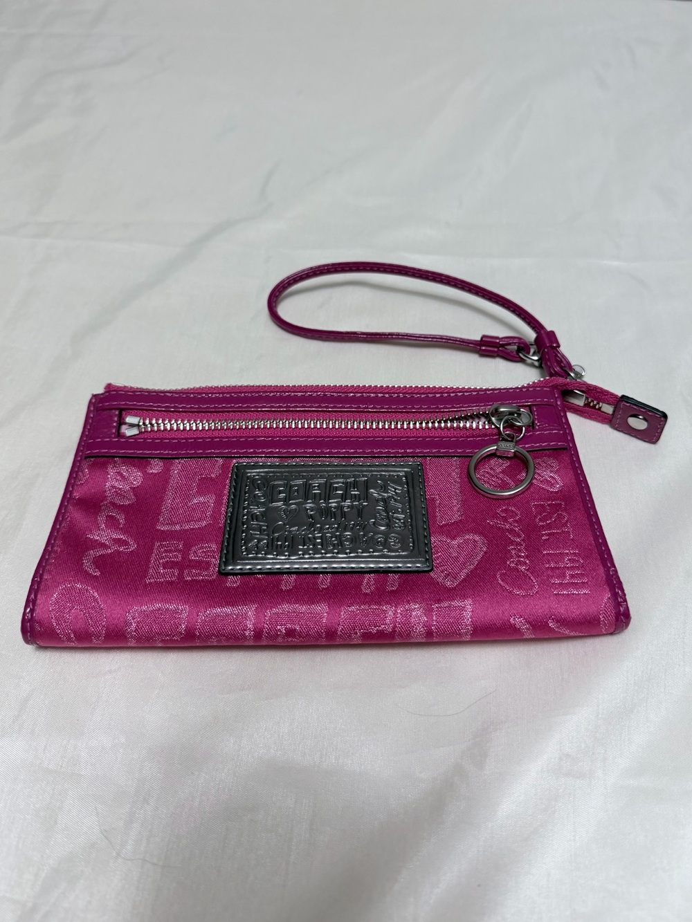Coach Pink wristlet  Signature Zip wallet ($98)